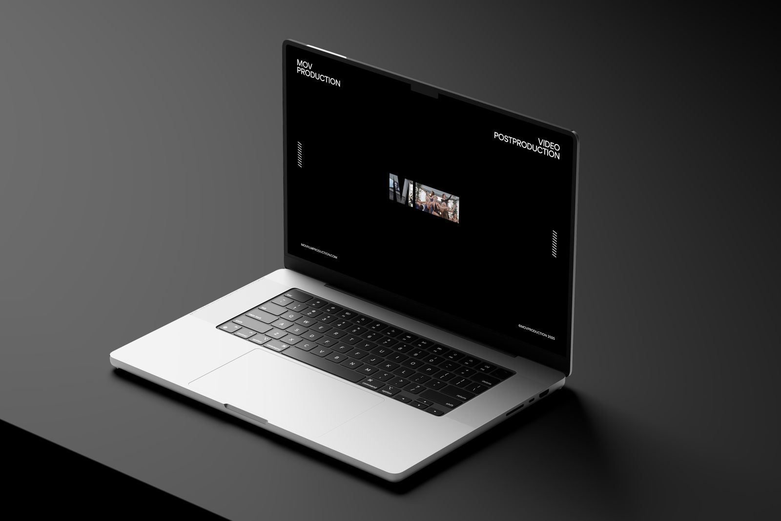 The MOV Production site on a laptop: a black page with the MOV wordmark playing footage inside the O